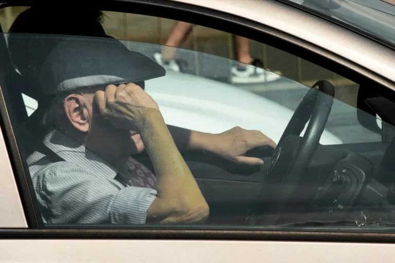Old man inside a car
